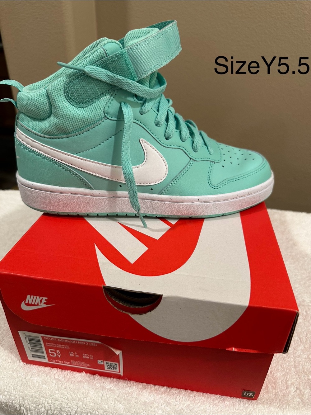 Nike Kids Mint Green High-Top Sneakers with White Swoosh